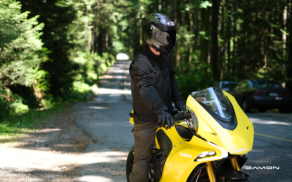 rider in the woods sitting on gold damon hypersport